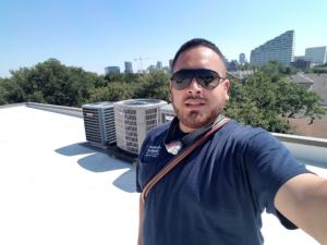 Jade with Jade AIr in Dallas, TX repairing the rooftop air conditioner