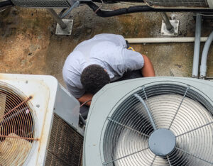 HVAC technician making repair to condo air conditioning unit
