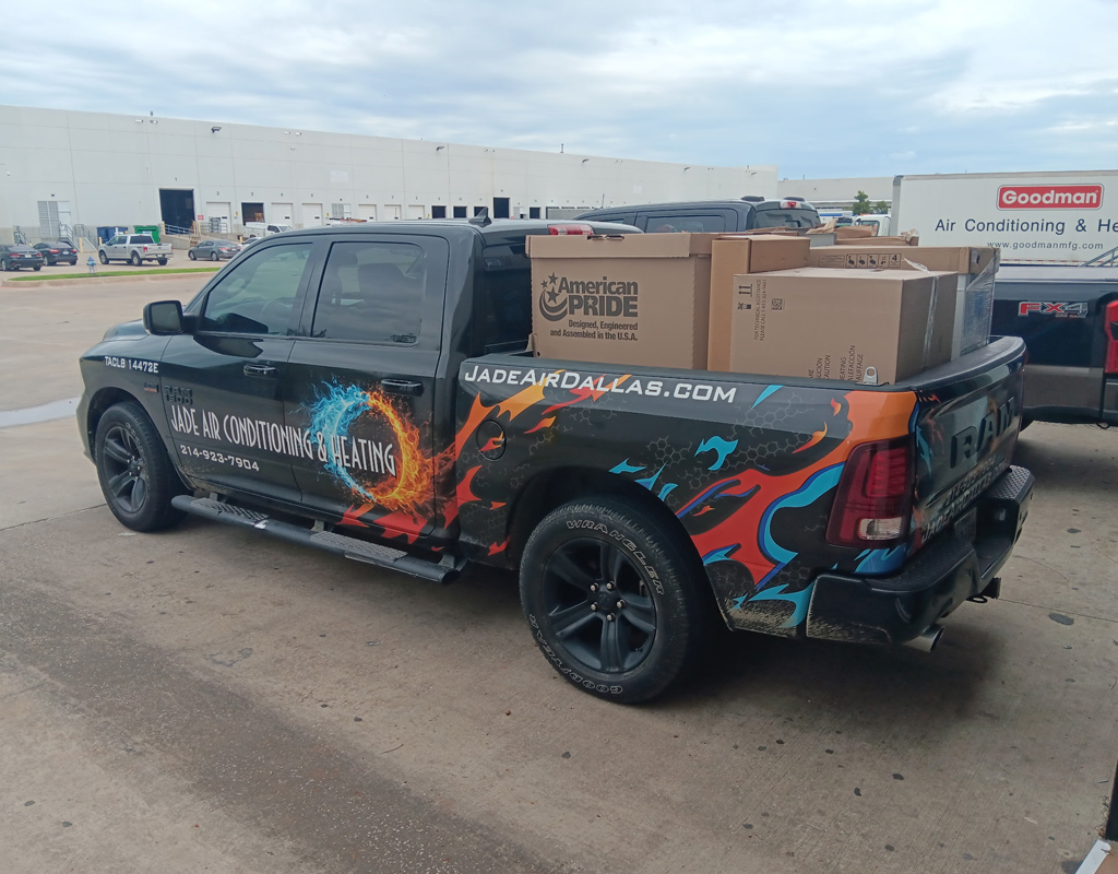 Jade Air service vehicle picking up brand new HVAC system before residential installation