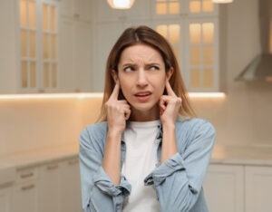 Woman hearing strange noises from her HVAC system